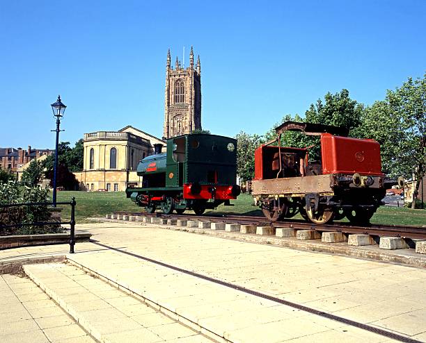 All Saints Cathedral, Derby. Derby, United Kingdom - May 23, 1992: All Saints Cathedral with locomotive in the foreground, Derby, Derbyshire, England, UK, Western Europe. derby city stock pictures, royalty-free photos & images