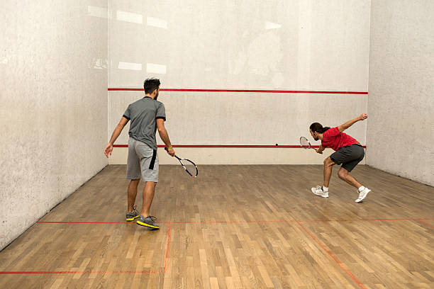 istock Young men exercising squash on a court. 510475012