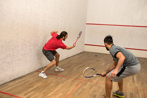 istock Two young athletic men playing squash on a court. 510475122