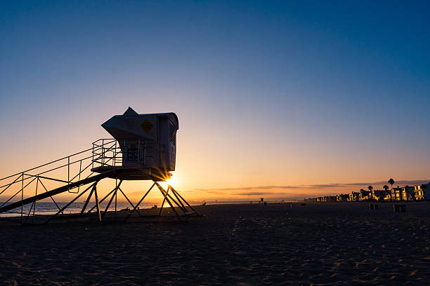 istock beach sunset with life guard tower 510475592
