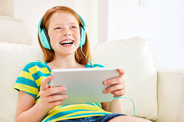 istock Watching her favorite cartoons online 510483352