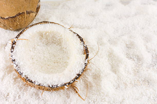 istock Halved fresh coconut and coconut powder 510484988
