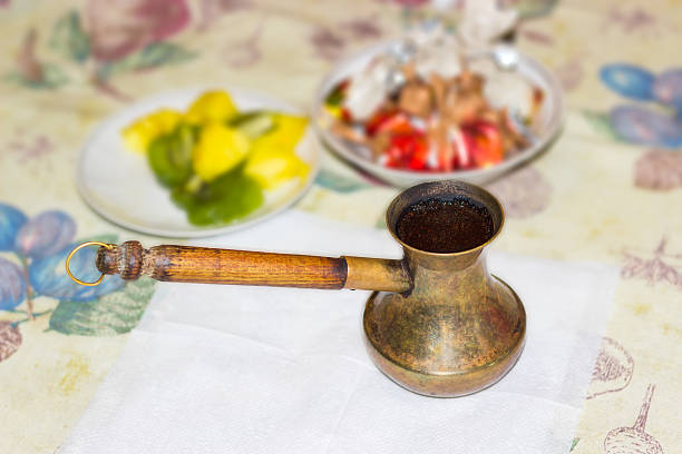 istock Coffee pot with freshly brewed Turkish coffee on a table 510486124