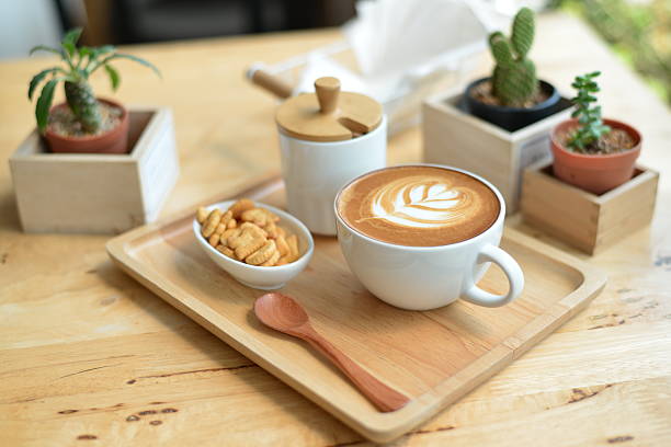 istock hot latte art  with cactus on table wooden 510486230