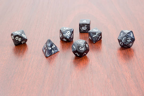istock Specialized polyhedral dice for role-playing games on wooden sur 510486604