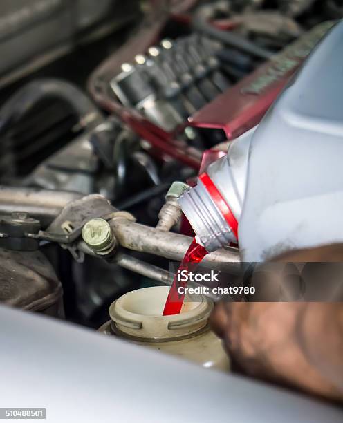 Hand Pouring Transmission Fluid Stock Photo - Download Image Now - Communication, Liquid, Car