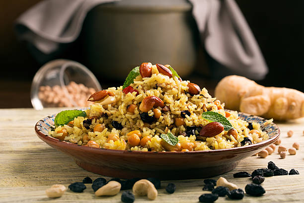 Traditional dish of rice (pilaf) cooked with spices stock photo