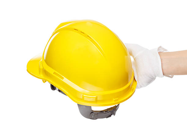 istock Construction helmet in the hand, isolated 510488926
