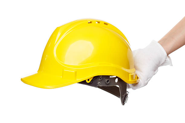 istock Construction helmet in the hand, isolated 510489050