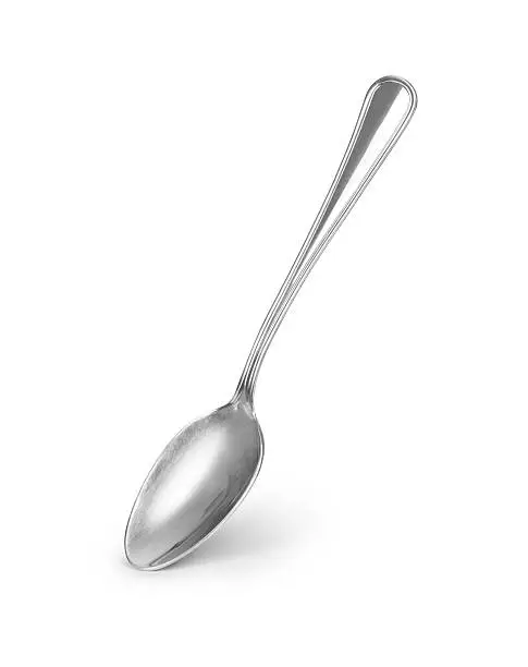 metal shiny spoon on white background