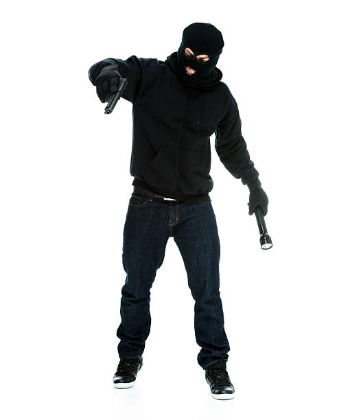 istock Robber in action with handgun & flash light 510490193