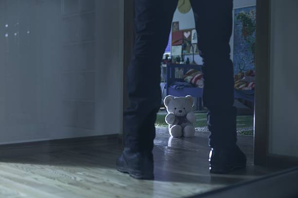 Pedophile standing at the entry