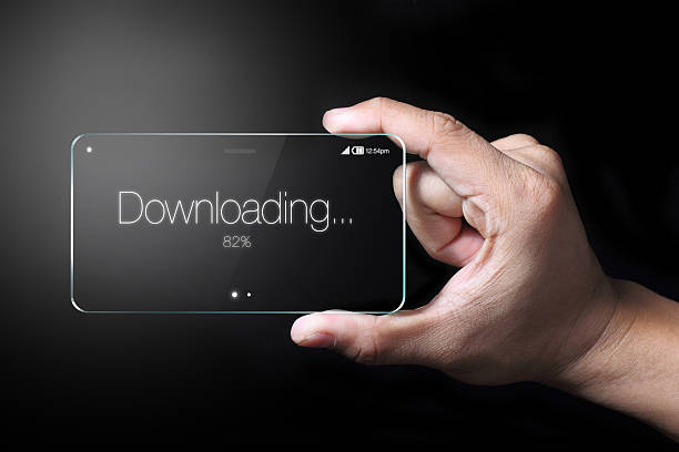 istock Transparent smartphone with downloading icon 510490846