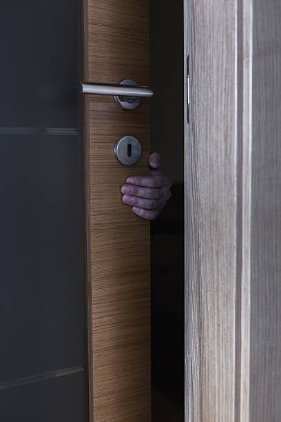 istock Robber behind doors 510491528