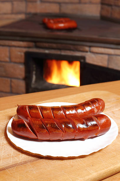 istock Grilled sausages at masonry oven background 510491592