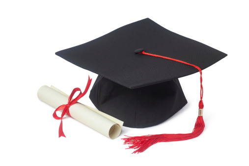 Graduation cap with diploma isolated on white background