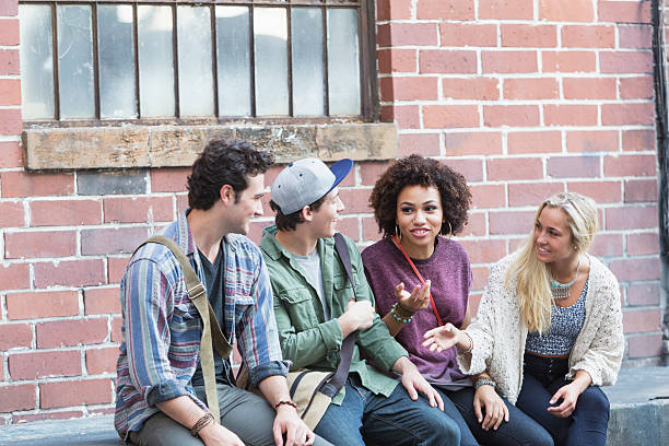 istock Young adults hanging out talking 510491659