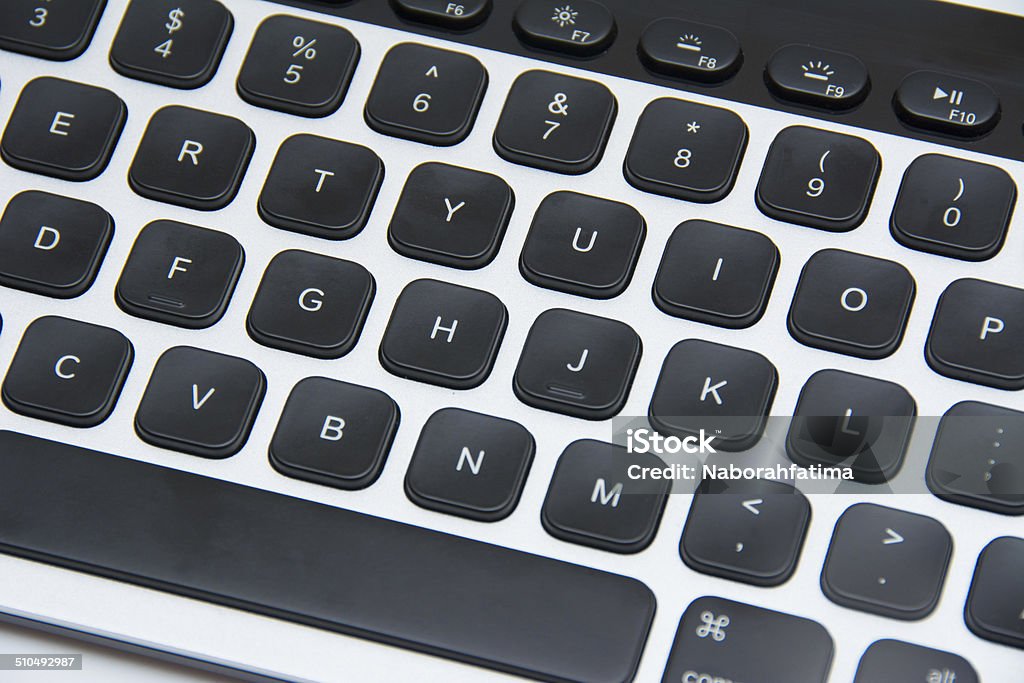 Modern aluminum computer keyboard isolated on white background Alphabet Stock Photo