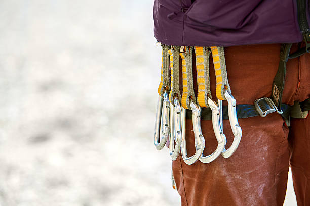 istock quick-draws on the  climber's harness 510493056