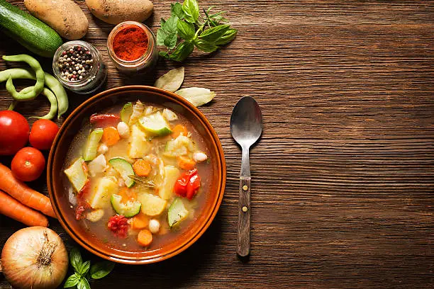 Fresh vegetable stew on wooden background overhead shoot