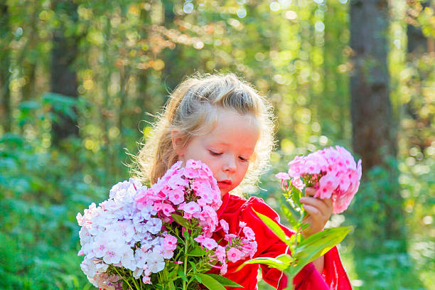 istock Girl with flowers 510495587