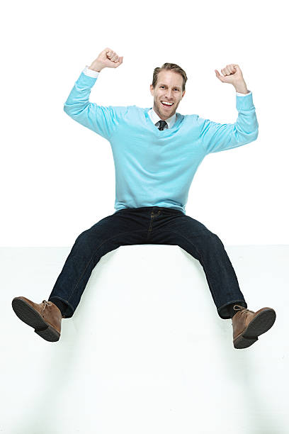 istock Cheerful man sitting on box & cheering 510495605