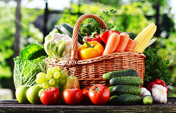 istock Wicker basket with assorted raw organic vegetables in the garden 510512081