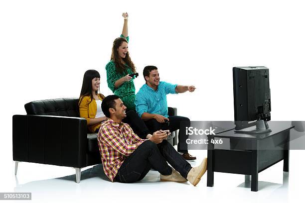 Group Of Friends Playing Video Game Cheering Stock Photo - Download Image Now - Friendship, Cut Out, Happiness