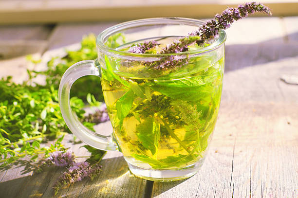 istock cups of tea with mint on wooden table 510513135