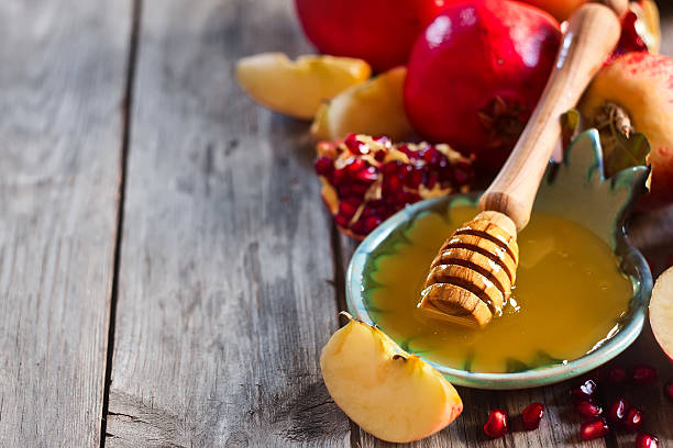 istock Pomegranate, apples and honey background 510514181