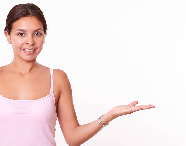 istock Friendly hispanic woman holding her left palm up 510515235