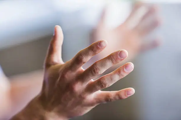 Photo of Close up of man's hands