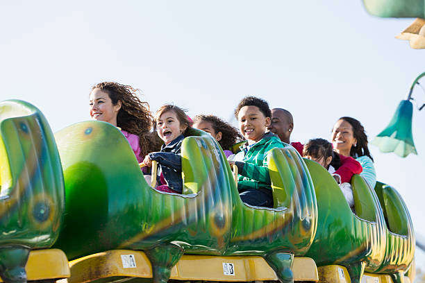 istock Multiracial group of children and adults on a rollercoaster 510516475