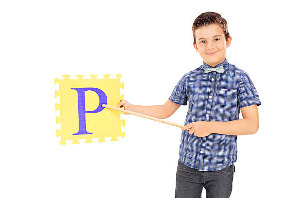 istock Boy pointing on a piece of puzzle with stick 510516895