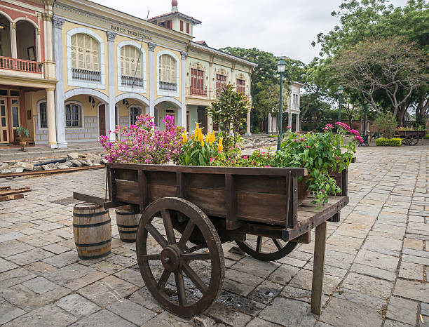 istock Vintage wheel barrel full of flowers 510519081