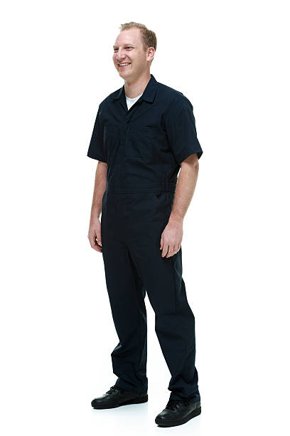 istock Smiling mechanic standing & looking away 510533635