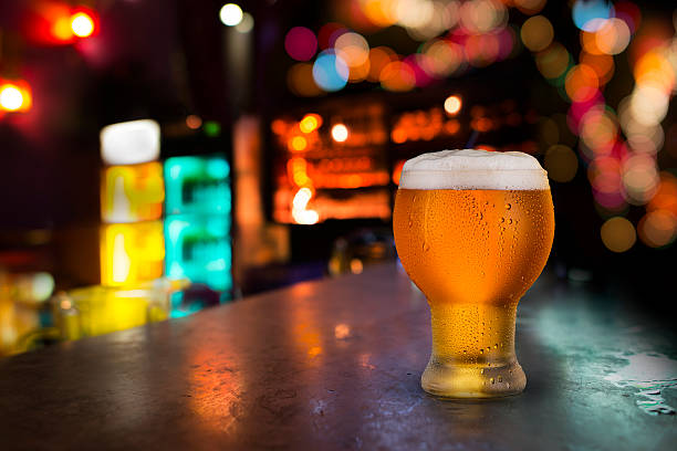 istock Glass of cold beer with bar scene 510534835