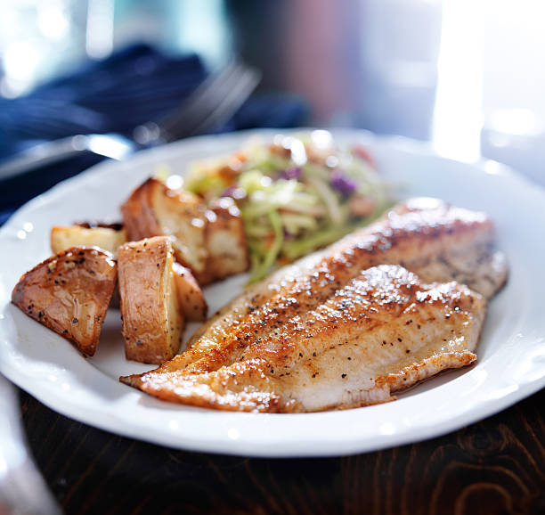 istock pan fried tilapia with asian slaw and roasted potatoes 510534967