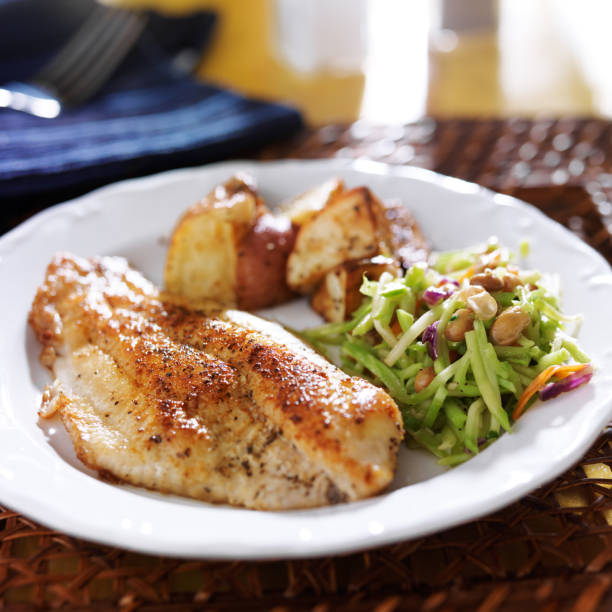 istock pan fried tilapia with asian slaw and roasted potatoes 510534969