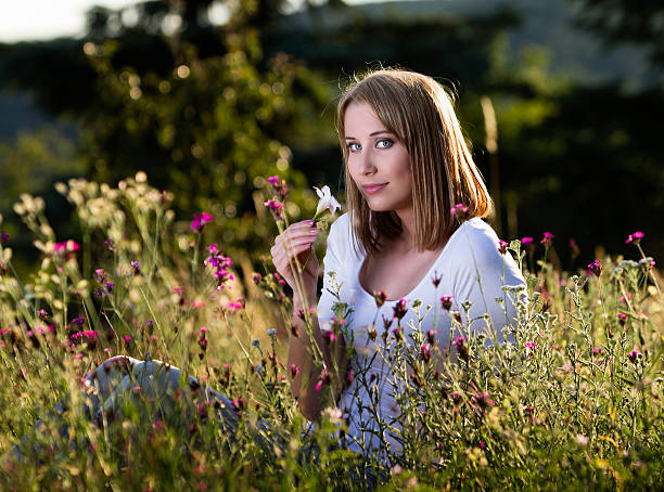 istock Woman in blooming meadow 510535915