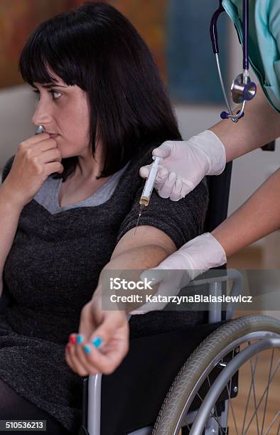 Nurse Doing Injection To Disabled Woman Stock Photo - Download Image Now - Adult, Assistance, Care