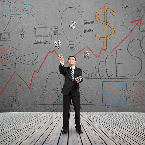 istock man catching and throwing money 510536503