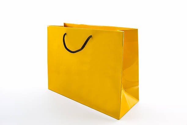 istock Blank yellow paper shopping bag. 510536779