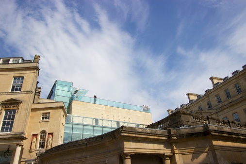 Bath, United Kingdom - May 19, 2014: A view of the rooftop of Thermae Bath Spa, the UK's only spa with natural thermal waters. The balcony shown is of the rooftop mineral pool where bathers soak with a view of the city's rooftops.