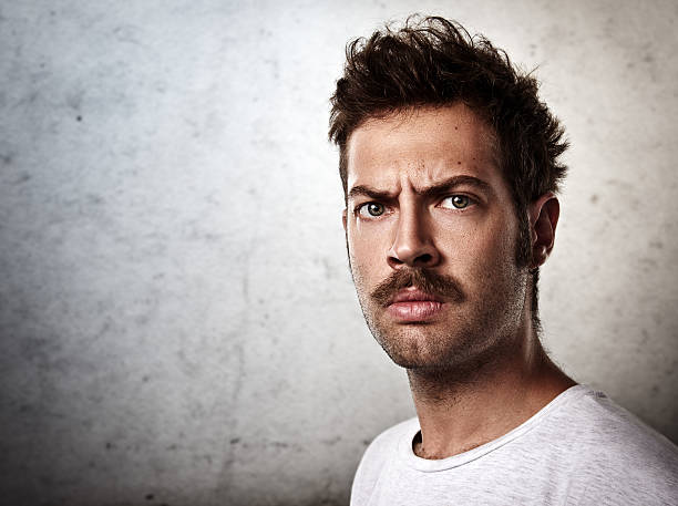 Portrait of a brutal man with a mustache