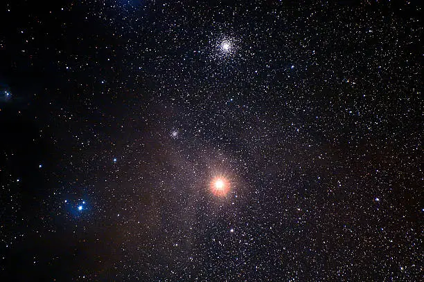 Dusty region arund antares including two globular clusters.