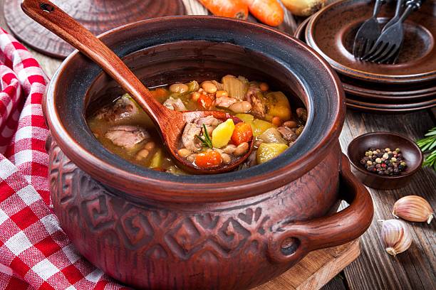 istock Vegetable stew with white beans, potatoes, carrots and chicken 510561624