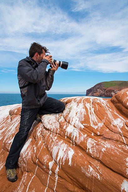 istock Photographer at the work on the beach. 510562537