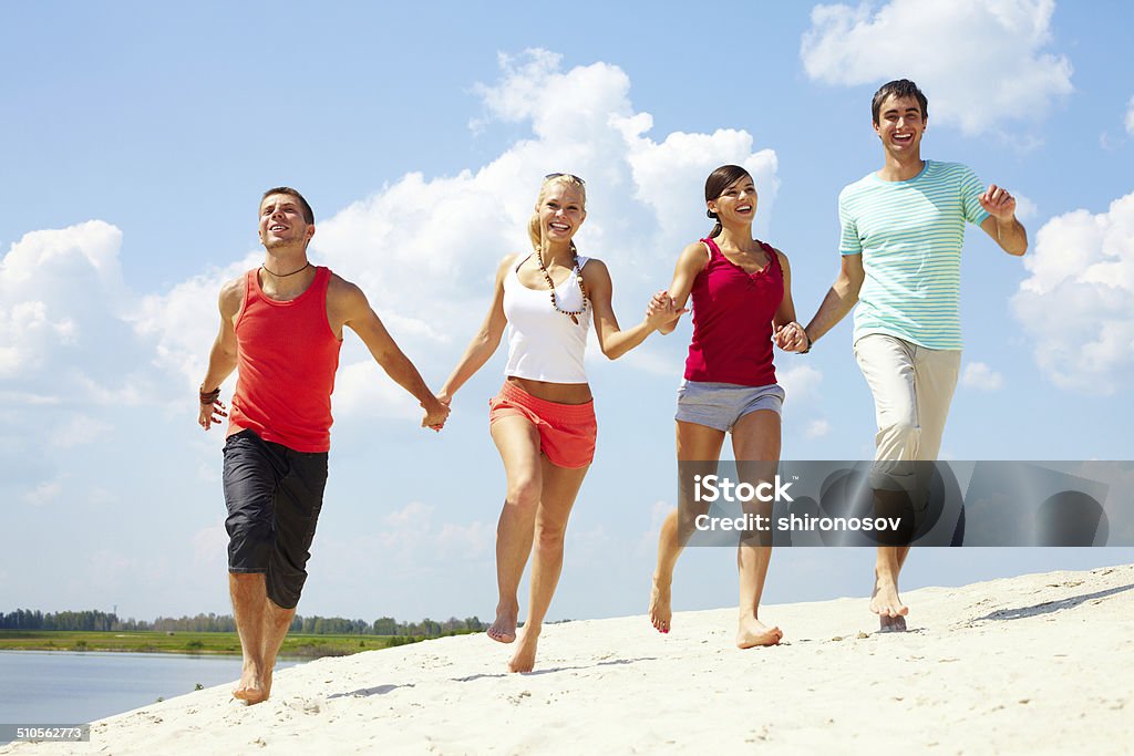 Happy friends Four friends having fun in summer Adult Stock Photo