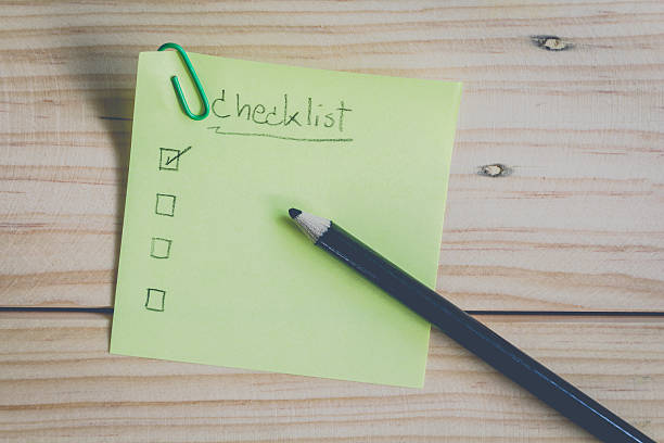 istock Checklist on colorful sticky note on wooden background 510563012